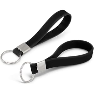A silicone key ring in black with a silver connector and keyring attachment. It features a debossed design.