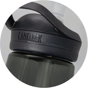 A drink bottle in dark grey with a black lid, featuring a logo and a flip-top spout.