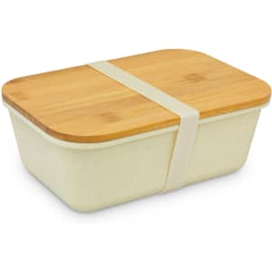 A rectangular lunch box in cream with a bamboo lid and a beige silicone band. It features a simple design.