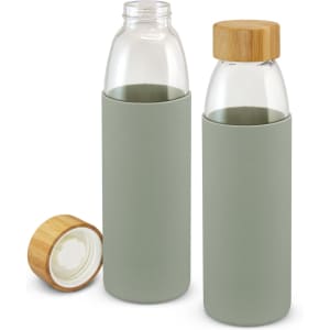 A drink bottle in soft green with a bamboo lid, featuring a glass body and a protective sleeve.