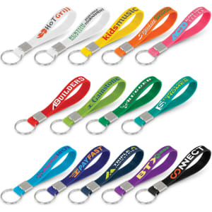 A collection of silicone key rings in various colours, each attached to a keyring and featuring debossed designs.