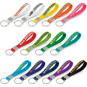 A collection of silicone key rings in various colours, each with an embossed design and a metal keyring attachment.