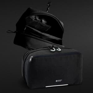 A black Swiss Peak toiletry bag featuring multiple compartments and a hook for hanging. It has a logo on the front.