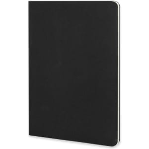 A black Moleskine Cahier Journal with a soft cover and rounded edges, featuring a subtle branding logo.