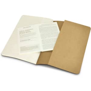 A Moleskine Cahier Journal in cream and brown, featuring lined pages and an inner pocket for storage.