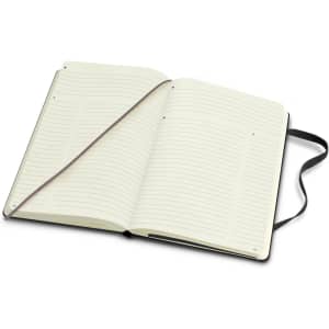 A large Moleskine Pro hard cover notebook with blank lined pages and a black cover. It includes a ribbon bookmark.