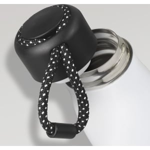 A drink bottle with a sleek white body and a black, textured lid featuring a black and white braided strap.