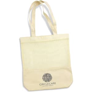 A beige cotton tote bag with a mesh section and long handles, featuring a logo on the front.