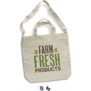 A cotton shoulder tote bag in cream, featuring a logo and text "Farm Fresh Products" in green and brown.