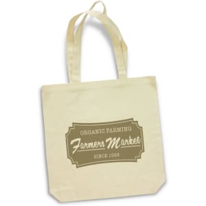 A cream-coloured cotton tote bag with sturdy handles and a logo featuring text about organic farming and a farmers market.