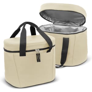 A cream cooler bag with black straps, featuring a zippered front pocket and a silver insulated interior.