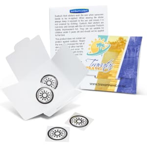 A pack of round, black and white sunburn alert stickers in an open white box, accompanied by a folder with a logo.