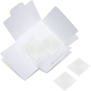 A white packaging box open to reveal circular stickers inside. The box has a logo on it.