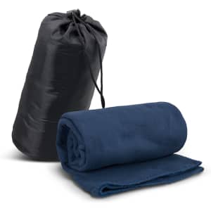 A navy fleece blanket rolled up next to a black carry bag, featuring a drawstring top.