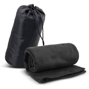 A black fleece blanket rolled and placed next to a matching carry bag, featuring a drawstring closure.