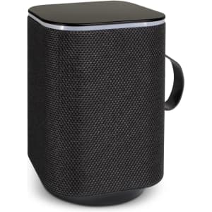 A rectangular black Bluetooth speaker with a textured exterior and a handle, featuring a sleek black top.
