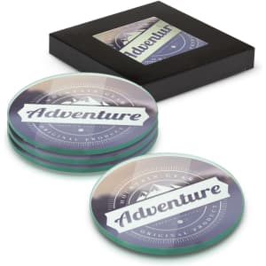 A set of four round glass coasters in full colour, featuring a logo, presented in a black box.