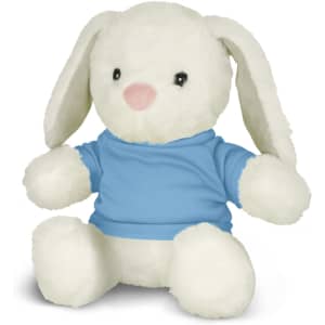 A soft white rabbit plush toy wearing a blue shirt, seated with its legs outstretched.