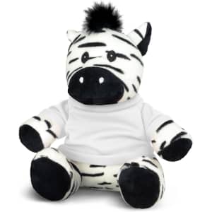 A plush zebra toy with black and white stripes, wearing a white shirt, featuring a black tuft on its head.