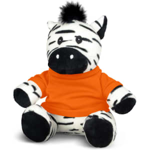 A plush zebra toy with black and white stripes, wearing an orange shirt and featuring a black tuft of fur on its head.
