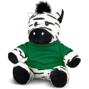 A plush zebra toy with black and white stripes, wearing a green shirt, featuring a small tuft of black fur on its head.