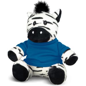 A plush zebra toy with black and white stripes, wearing a blue shirt, featuring a tuft of black hair on its head.