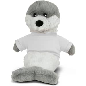 A plush seal toy in grey and white, wearing a plain white T-shirt. It has a friendly expression and soft fur.