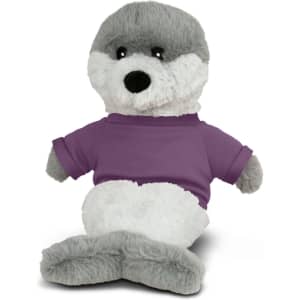 A grey and white plush seal toy wearing a purple shirt, sitting upright with a friendly expression.