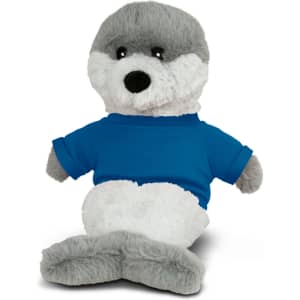A plush toy seal with grey and white fur, wearing a blue shirt, sitting upright. It has a friendly expression.