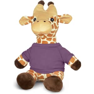 A plush giraffe toy with a yellow and brown design, wearing a purple shirt, sitting upright. It has a logo on it.