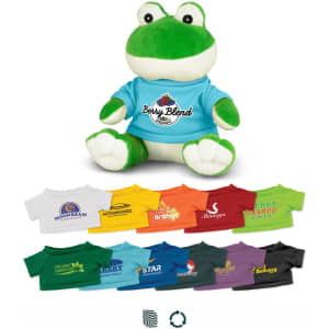 A green frog plush toy wearing a blue shirt, with various colourful mini t-shirts displayed below.