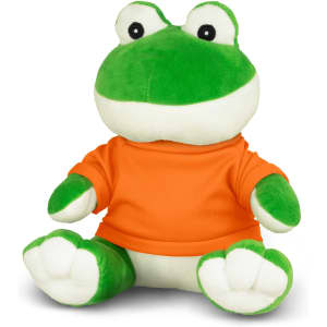 A green plush frog toy wearing an orange shirt, sitting with its legs extended and a friendly expression.
