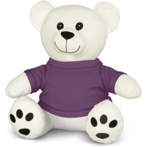 A white plush bear toy with a purple shirt and black paw prints, featuring a friendly smile and large round ears.