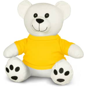 A white plush bear wearing a yellow shirt, featuring black paw prints and buttons for eyes.