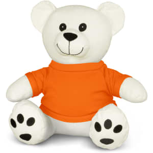 A white plush bear toy with an orange shirt and black paw prints, featuring a smiling face and rounded ears.