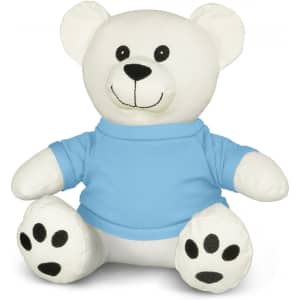 A white plush bear toy wearing a blue shirt, with black paws and a smiling face. It has a simple logo on the shirt.