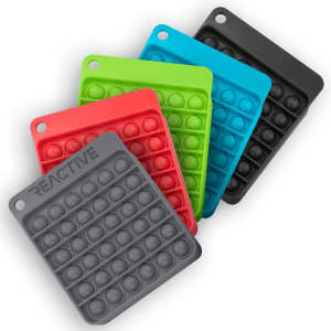 A collection of five silicone Pop Bubble Boards in black, red, green, and blue. Each features circular poppable bubbles.