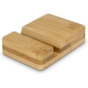 A bamboo phone stand with a smooth finish, featuring a minimalist design and natural wood tones. It has a small cutout for stability.