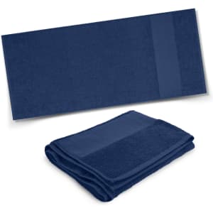 A navy blue bath towel neatly folded and laid out flat, featuring a textured band and a logo.