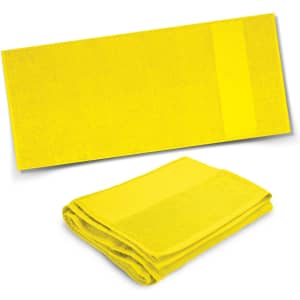 A bright yellow bath towel in two positions: one unfolded and one neatly folded, featuring a subtle branding logo.