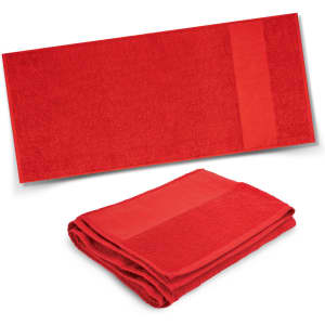A red terry towel featuring a smooth strip and a folded design, showcasing its soft texture. Contains branding.