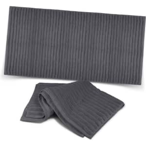 A grey luxury bath towel set with a textured design, featuring a large towel and a smaller hand towel.