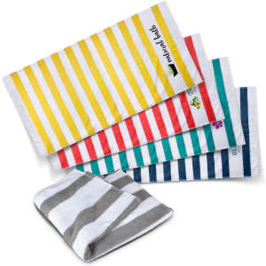 A collection of striped beach towels in yellow, red, turquoise, and navy, with one folded grey towel. Each towel has a logo.