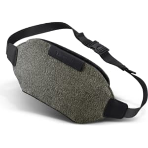 A textured green and grey belt bag with a black adjustable strap and a logo.