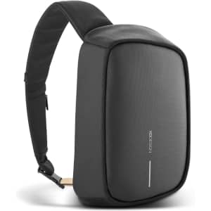 A black sling bag with a slim design, featuring a textured surface and a strap for easy carrying.