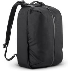 A black gym bag with a sleek design, featuring a single zip closure and adjustable shoulder straps.