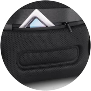 A black gym bag with a textured surface, featuring a zippered pocket containing a tablet or similar device.