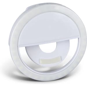 A circular white selfie phone light featuring an integrated stand and LED lights around the edge.