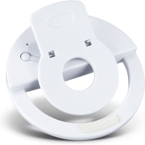 A white selfie phone light with a circular design and a slot for attachment, featuring a small logo.