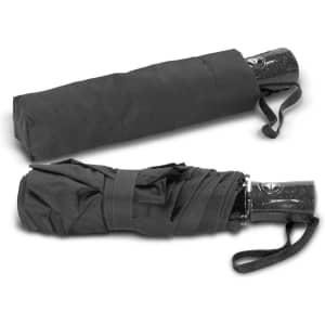A black Dew Drop Umbrella, fully closed and folded, with a matching cover and a handle featuring a logo.